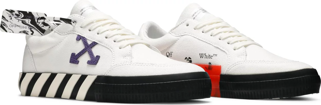 pair of off white shoes with purple arrow logo